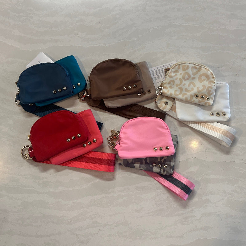 Collection of small handbags on a light gray surface