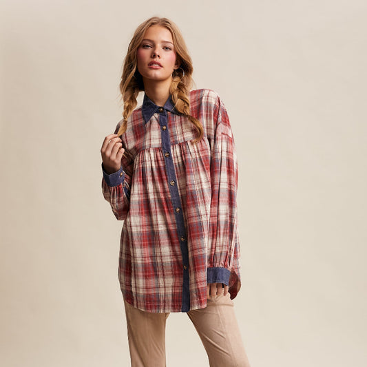 Woman wearing a plaid shirt and beige flared pants on a beige background