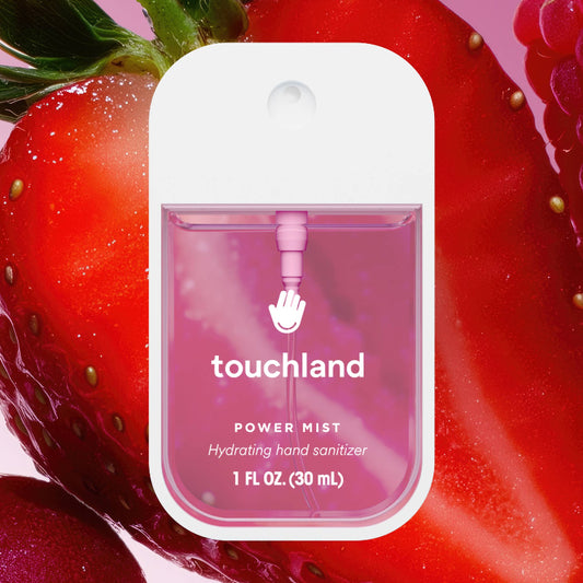 Touchland hand sanitizer packaging with strawberries in the background