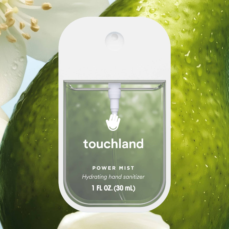 Touchland power mist hand sanitizer packaging on a green background