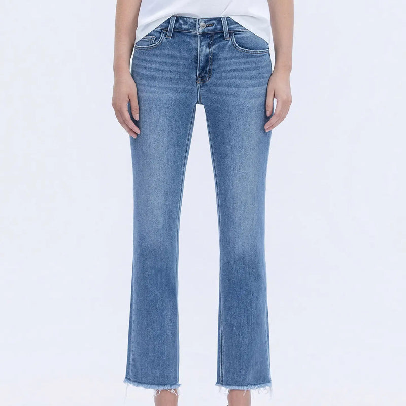 Person wearing blue jeans on a white background