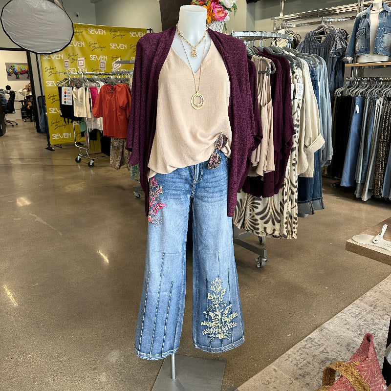 Clothing display with jeans and shirts in a store setting